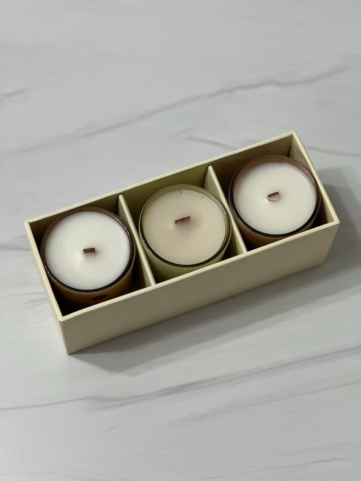 Three candles in a beige gift box are the perfect gift for this holiday season
